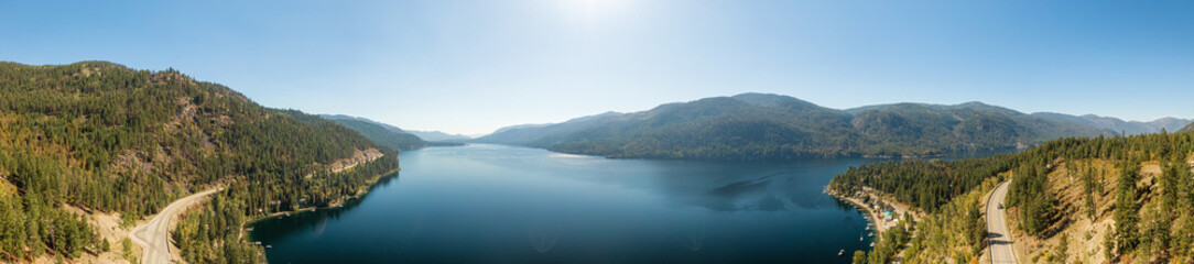 Fototapeta na wymiar Aerial View of Christina Lake, British Columbia, Canada. Nature Mountain Landscape Background. Summer Sunny Day.