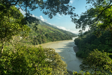 Fototapeta na wymiar Natural landscape overlooking the Cauca river in Puerto Valdivia, Antioquia, Colombia.