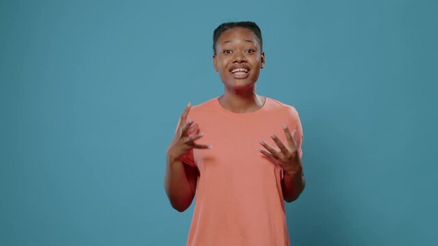 Furious woman showing middle finger in front of camera and fighting. Aggressive person feeling angry and doing obscene gesture to insult and provoke. Rude adult giving offensive message