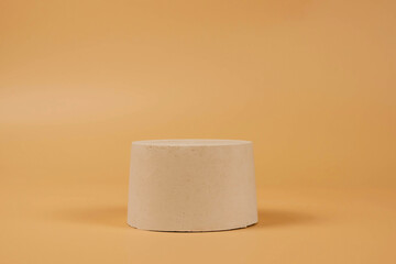 Abstract minimal scene with geometrical form. Cylinder podium on beige background. Abstract background. Scene to show cosmetic podructs.