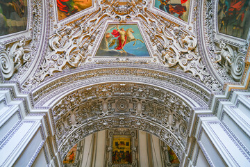 Salzburg Cathedral or Salzburg Dom is the baroque roman catholic church with white painted ceiling in Salzburg, Austria.