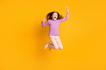 Fototapeta na wymiar Full length body size view of attractive cheerful girl jumping rejoicing great success isolated over bright yellow color background