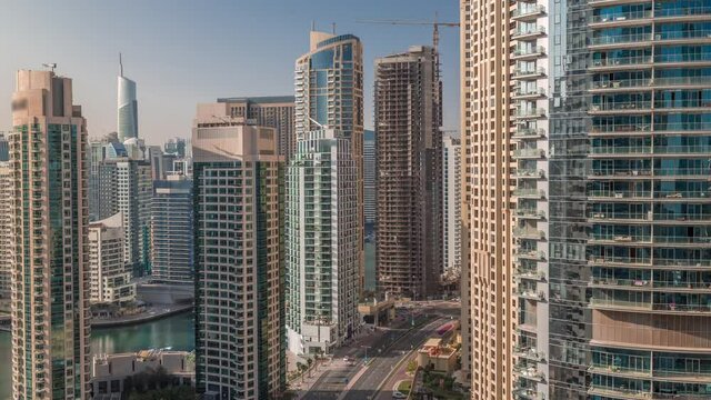 Aerial view on Dubai Marina skyscrapers and the most luxury yacht in harbor timelapse, Dubai, United Arab Emirates