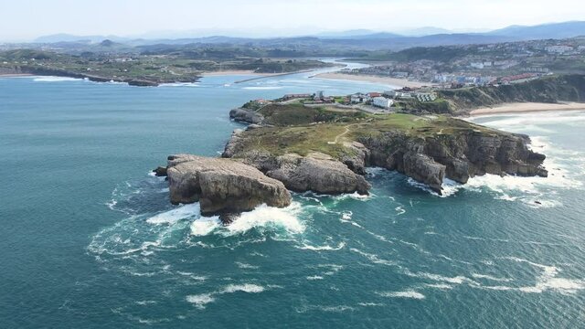 Aerial view of a scenic coastline landscape in Suances, Cantabria, Spain. High quality 4k footage