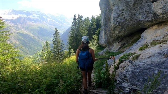 Via Ferrata from Murren to Gimmelwald. Risky rock climbing on Swiss Alps.