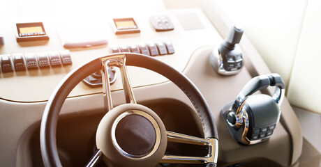 Steering wheel on luxury yacht cabin