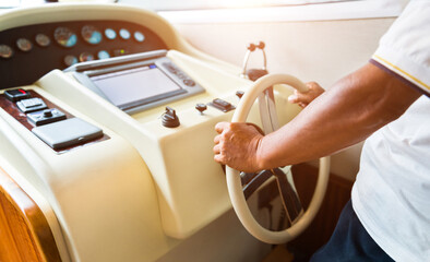 People at the helm of luxury yacht