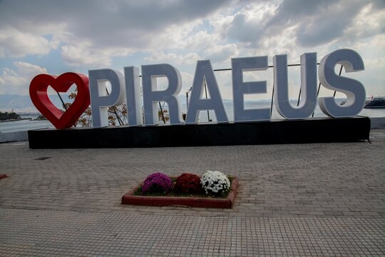 Love Piraeus signboard in large letters at the Marina of the Greek port city Piraeus