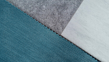 close up interior design mood board consists light blue or cyan woolen fabric, stone tile,...