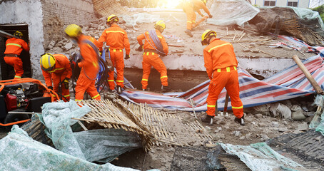 Search and rescue forces searching through a destroyed building