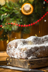 Christmas Stollen on Wooden Background. Festive Homemade Sweet Food