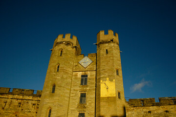 old British Castle in warwick westmidlands in golden autumn light with the blue sky background...