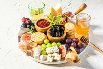 Cheese Platter or Cheese Board with Fruits, HErbs, Honey and Crackers