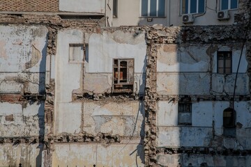 view at the remaining facade of a demolished house in Piraeus