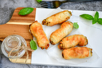  Greek style Mini filo pastry rolls with mushrooms.Home made bakery .Fresh baked  Mini cheese  ,meat and herbs puff pastries