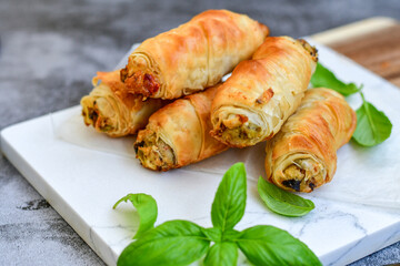  Greek style Mini filo pastry rolls with mushrooms.Home made bakery .Fresh baked  Mini cheese  ,meat and herbs puff pastries