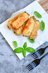  Greek style Mini filo pastry rolls with mushrooms.Home made bakery .Fresh baked  Mini cheese  ,meat and herbs puff pastries