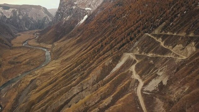 Katu Yaryk mountain pass in the valley of the Chulyshman River, Altai, Siberia, Russia. A dangerous empty serpentine highway, a huge stone gorge, a canyon, a mountain winding river. Freedom