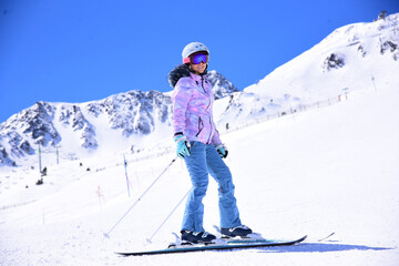 Fototapeta na wymiar Woman in the snow practicing skiing