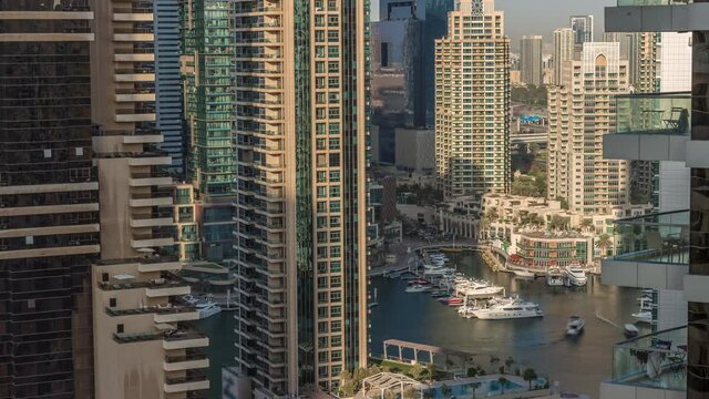 Aerial view on Dubai Marina skyscrapers and the most luxury yacht in harbor timelapse, Dubai, United Arab Emirates