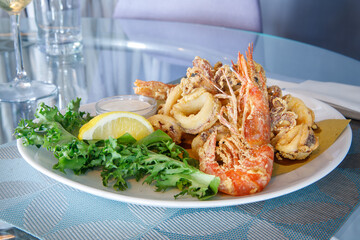 Dish of fried squid rings and shrimps, mediterranean food