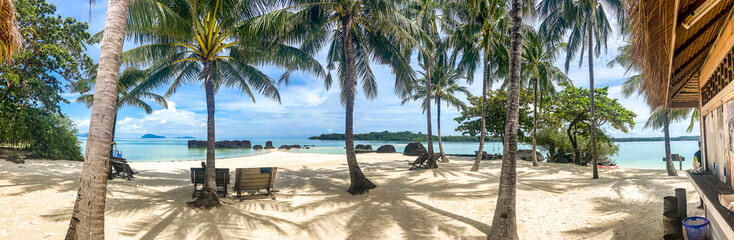 Beautiful tropical island koh Kham, white sand beach with volcanic rocks, near koh Mak, Trat, Thailand