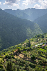 Obraz premium Small farms and idyllic hills view from Triora, Liguria, Italy