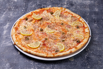 fish pizza on the dark background