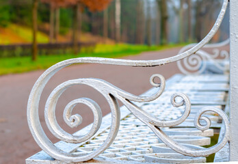 Part of a bench against the background of the autumn Catherine Park in Tsarskoye Selo, Pushkin, St....