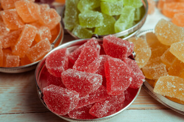 Dessert marmalade in the form of lemon and orange slices. The sweetness of jelly candy.