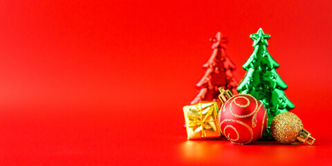 Christmas tree and baubles on red background new year  holiday celebration concept