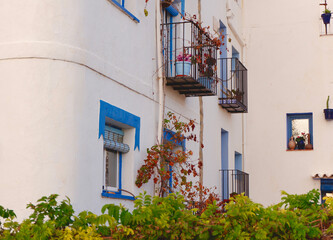Spanish cosy yard with leafy plants, balconies and windows in Peniscola, Spain
