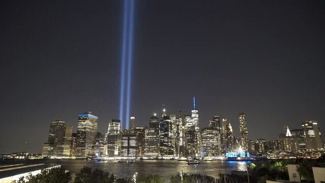 Wide Tilt Up From Downtown Manhattan To September 11th Memorial Lights