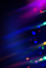 Bright abstract blurred background with bokeh. Blurred lights, neon glowing lines on a dark...