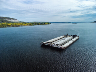 Unloaded barge awaiting pushboat on river.