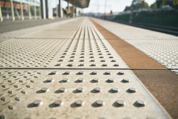Tactile pathway for the people with blindness in urban area. Pedestrian walkway for blind people in the railway station area. Concept of the good infrastructure.