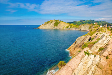 Fototapeta na wymiar View of the bay of Zumaya with Izurrum beach and the Flysch cliff that protects it. Euskadi, Spain