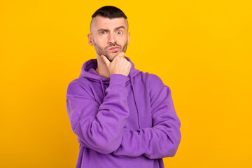 Fototapeta premium Photo portrait young man wearing violet sportswear thoughtful got idea isolated vibrant yellow color background