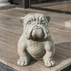 concrete sculpture of a formidable bulldog. The concept of strength, power