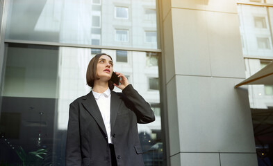 Horizontal confident lifestyle portrait of a beautiful woman, business person, freelancer,...