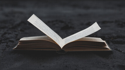 open book on black background