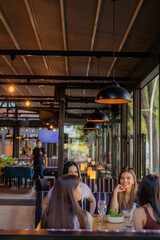 Sitting and enjoying their time at the cafe