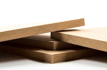 Four brown mdf boards in an optional setting on a white surface.