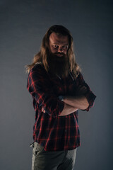 Beautiful strong nordic man with stylish hairstyle and beard on a isolated background.