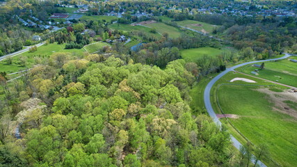 Fototapeta na wymiar An Aerial View of Beautifully Blooming Colored Trees and Plants and Unique Structures on a Spring Day