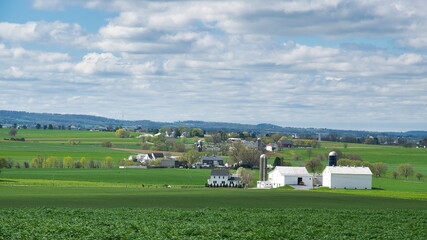 An Amish Barn and Silo in the Countryside as Seen on a Beautiful Sunny Day