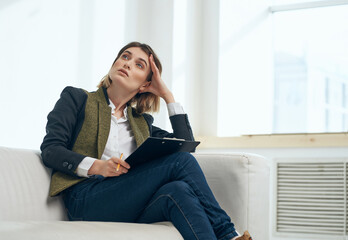 Fototapeta premium Business woman sitting on the couch working manager