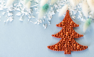 Christmas tree red color on a blue background, festive background