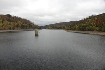 Fototapeta na wymiar Damm of Lake Primstalsperre water reservoir, Nonnweiler, Saarland, Germany 