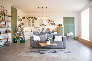 Modern Kitchen Interior with Island, Sink, Cabinets in New Luxury Home Decorated in Christmas Style